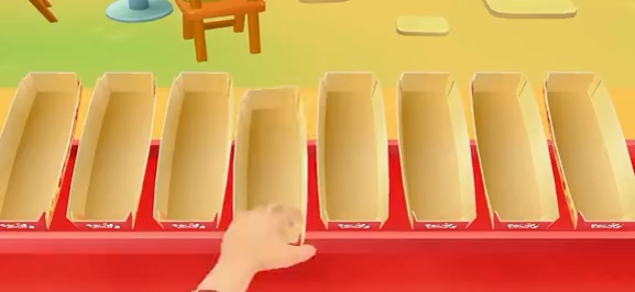 Préparation d'un hot-dog dans HotDog Street